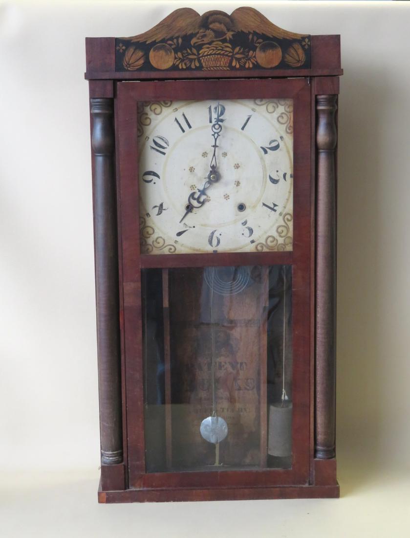 Connecticut mahogany shelf clock with hand painted: Connecticut mahogany shelf clock with hand painted spread wing eagle crest, hand painted face and half columns each side of door - with weights and pendulum - non-working (works for a while then stops