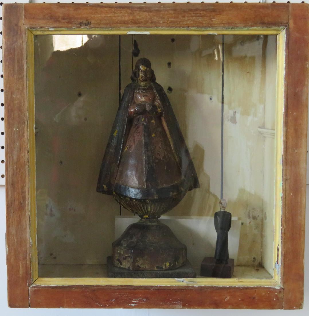 Wooden sculpture of "Lady of Guadalupe". The Lady with: Wooden sculpture of "Lady of Guadalupe". The Lady with long carved hair and colorful costume, appears to retain original paint - 17th/18th century. Missing hands, some paint losses, but overall good c