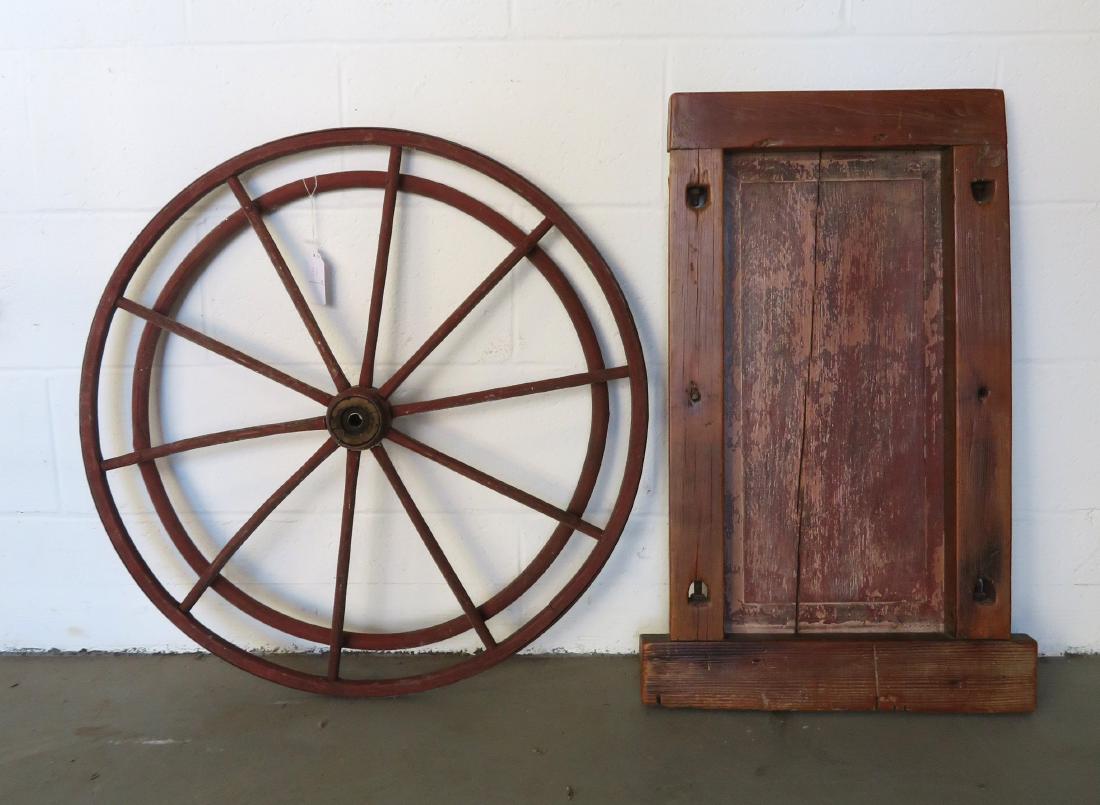 Two architectural items including a wooden boardwalk: Two architectural items including a wooden boardwalk strolling wheel - late 19th century - very good condition - 28"D; and a wooden panel - 19" x 29 1/2" - good condition - 19th century.