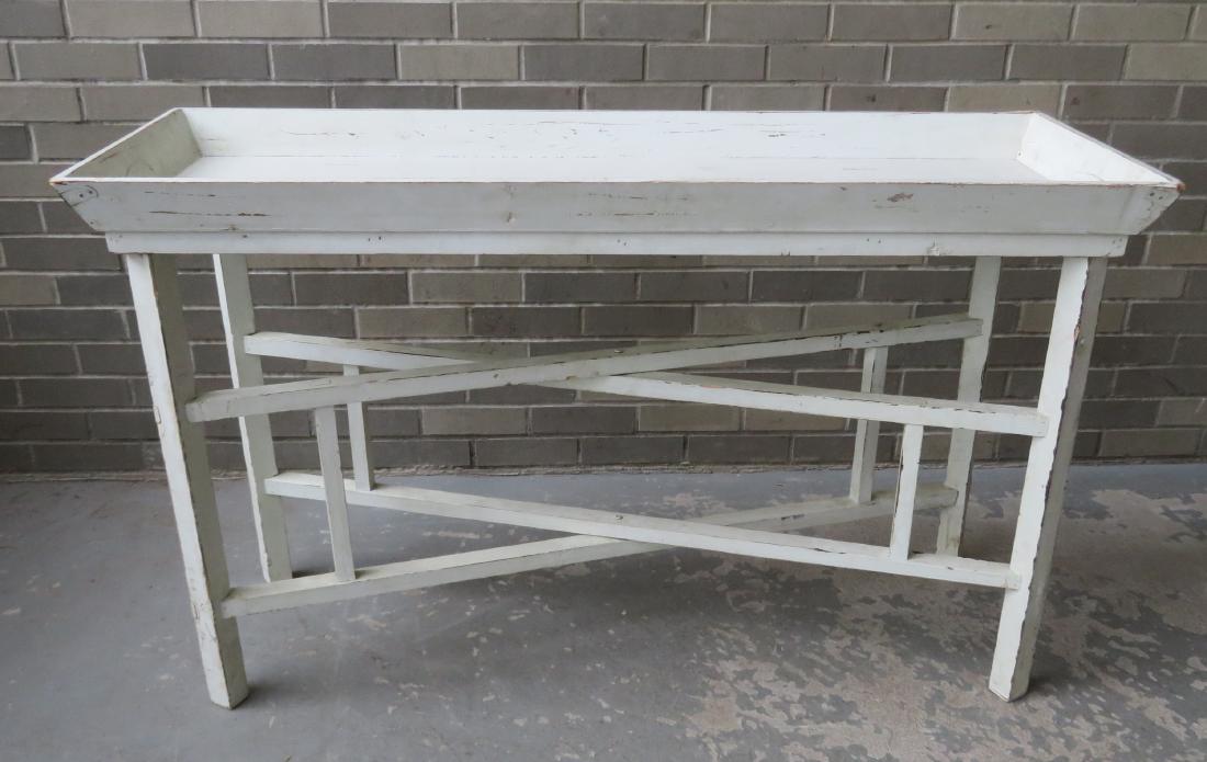 A 2 part seed sorting table - folds up for easy storing: A 2 part seed sorting table - folds up for easy storing - 50 1/4"L x 18"W x 30 1/4"H - wood chip in one corner of top, minor use wear to white paint, overall good condition. Probably mid 20th century.