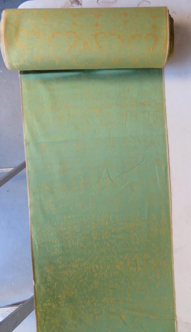 Bolt of silk brocade fabric. Green and gold - pattern: Bolt of silk brocade fabric. Green and gold - pattern difficult to discern, probably by design. Two small holes along the border, otherwise excellent condition. 38 yards x 22 1/2"
