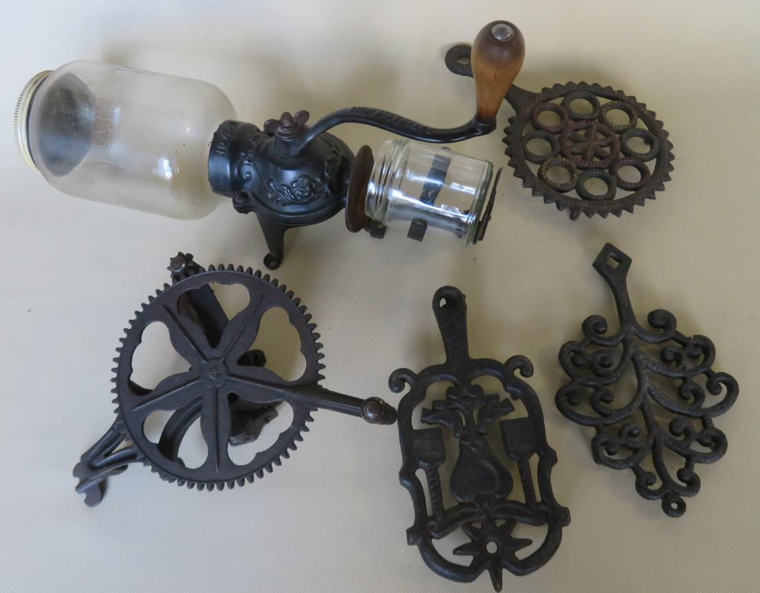 Grouping of 5 country items including a Parker No. 441: Grouping of 5 country items including a Parker No. 441 wall mounted coffee grinder, a cast iron apple peeler signed S.S. Hershey patent Aug. 30, 1884 - very good condition, and 3 cast iron trivets inc