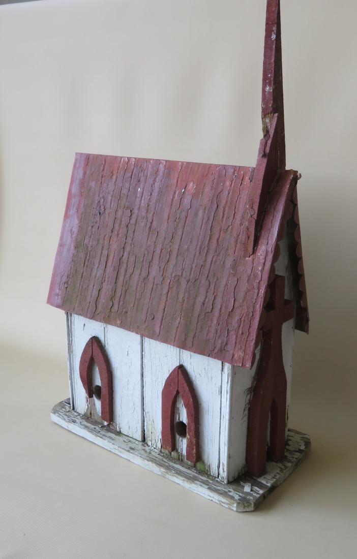 Old hand made wooden bird house in the form of a church: Old hand made wooden bird house in the form of a church with tin roof - some losses, but overall good condition. 9"W x 19"L x 20 1/2".