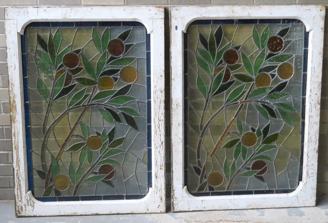 Beautiful pair of leaded and stained glass windows: Beautiful pair of leaded and stained glass windows depicting oranges in tree branches, late 19th century. Overall sizes 30" x 40 1/2". Several small cracks in glass, small < 1"L piece of glass missing