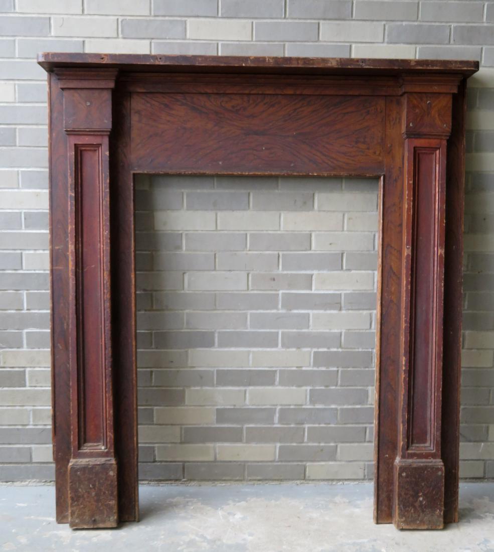 Grain painted fireplace mantel in original red/black: Grain painted fireplace mantel in original red/black paint, having paneled sides and rectangular top, circa 1850, typical of NY state. Overall size 52 14"W x 7"D x 57 1/4"H - opening 30 1/2"W x 43 1/2