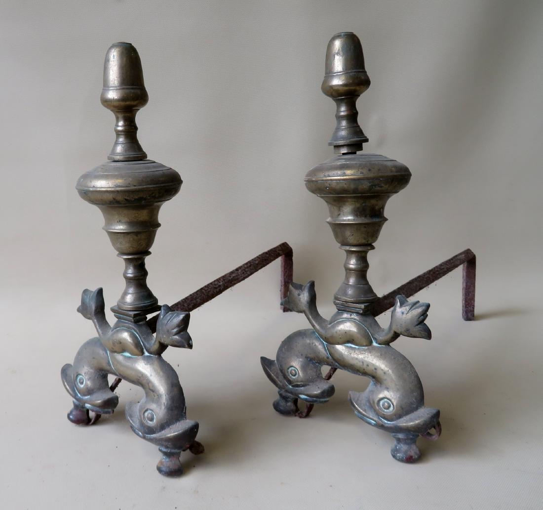 Pair of brass French andirons, 18th century, decorated: Pair of brass French andirons, 18th century, decorated with a dolphin base - 14.5"H. Good condition. Provenance: From a private collection of Country Americana and fine Decorative Arts of a retiring l