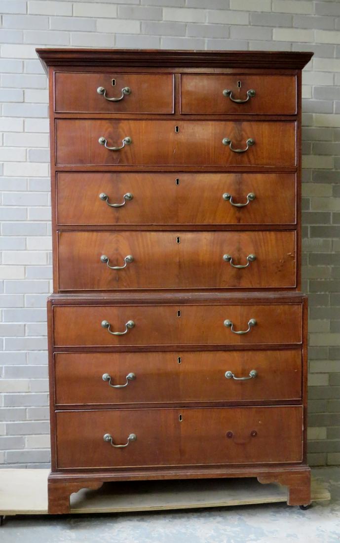 Chippendale mahogany and cherry chest on chest. The top: Chippendale mahogany and cherry chest on chest. The top section having a small molded cornice over 2 short mahogany drawers over 3 graduated mahogany drawers. The bottom section with 3 graduated mahog