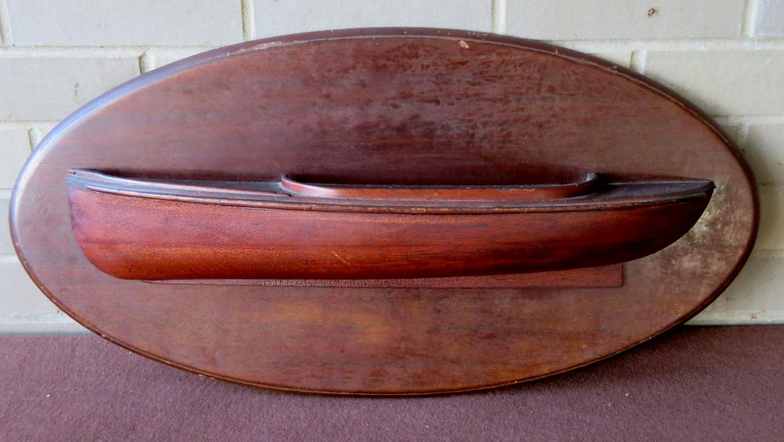 Half-hull laminated ship model in old varnish finish: Half-hull laminated ship model in old varnish finish mounted on its original black walnut oval panel, probably late 19th century. Some expected crazing to varnish, otherwise very good untouched condit