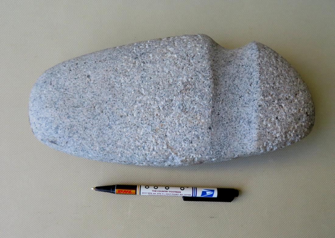 An ancient Native American axe head - 10 1/2"L x 5: An ancient Native American axe head - 10 1/2"L x 5 1/4"H. Very good condition. Provenance: From a private collection of Country Americana and fine Decorative Arts of a retiring local attorney, downsiz