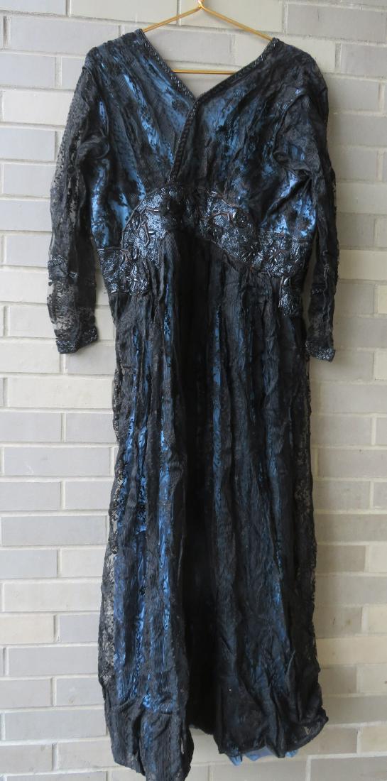 Two vintage costumes and a vintage black cape.: Two vintage costumes and a vintage black cape. Includes: 1) Franklin Simon Co. NY, vintage heavily embroidered black velvet cape with silk lining, very good condition - Early 20th century - 50"L; 2) A