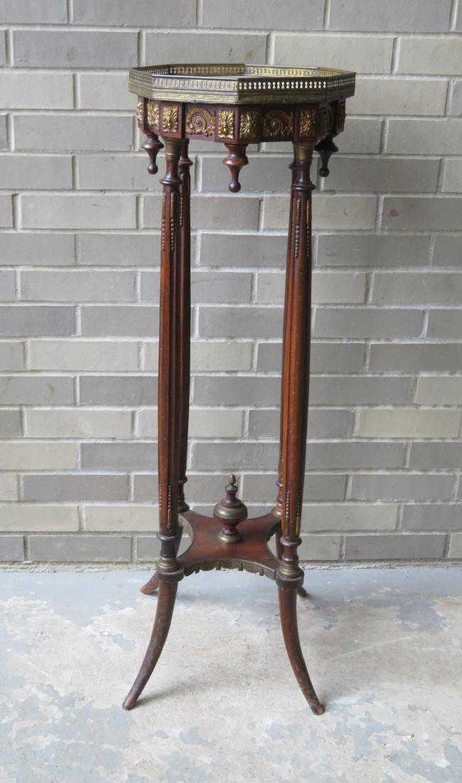 Fancy French style plant stand having an octagonal: Fancy French style plant stand having an octagonal shaped top with pierced brass gallery and alabaster insert, over an apron with ormolu, over 4 fluted legs that also support a bottom shelf with turne