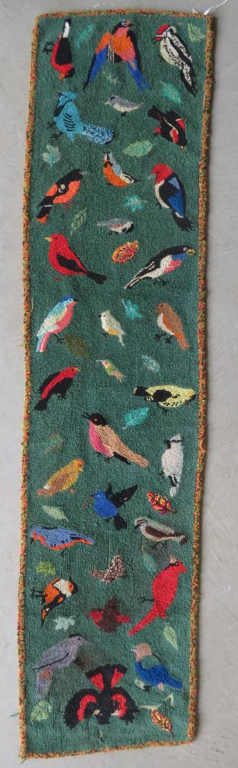 Small hooked rug runner decorated with many colorful: Small hooked rug runner decorated with many colorful American birds on a green ground - several small areas of wool losses, otherwise good condition. 81 1/2" x 20". Mid to late 20th century.