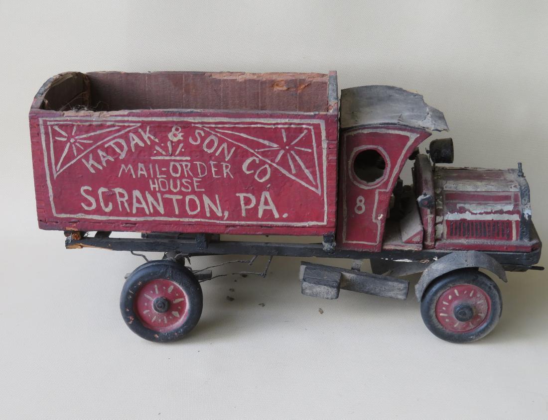 Hand made and hand painted advertising truck model for: Hand made and hand painted advertising truck model for "Kadak & Son Co. / Mail - Order House / Scranton, PA.", early 20th century. Some losses to roof, loose axel, overall fair condition. 19"L x 9 1/2