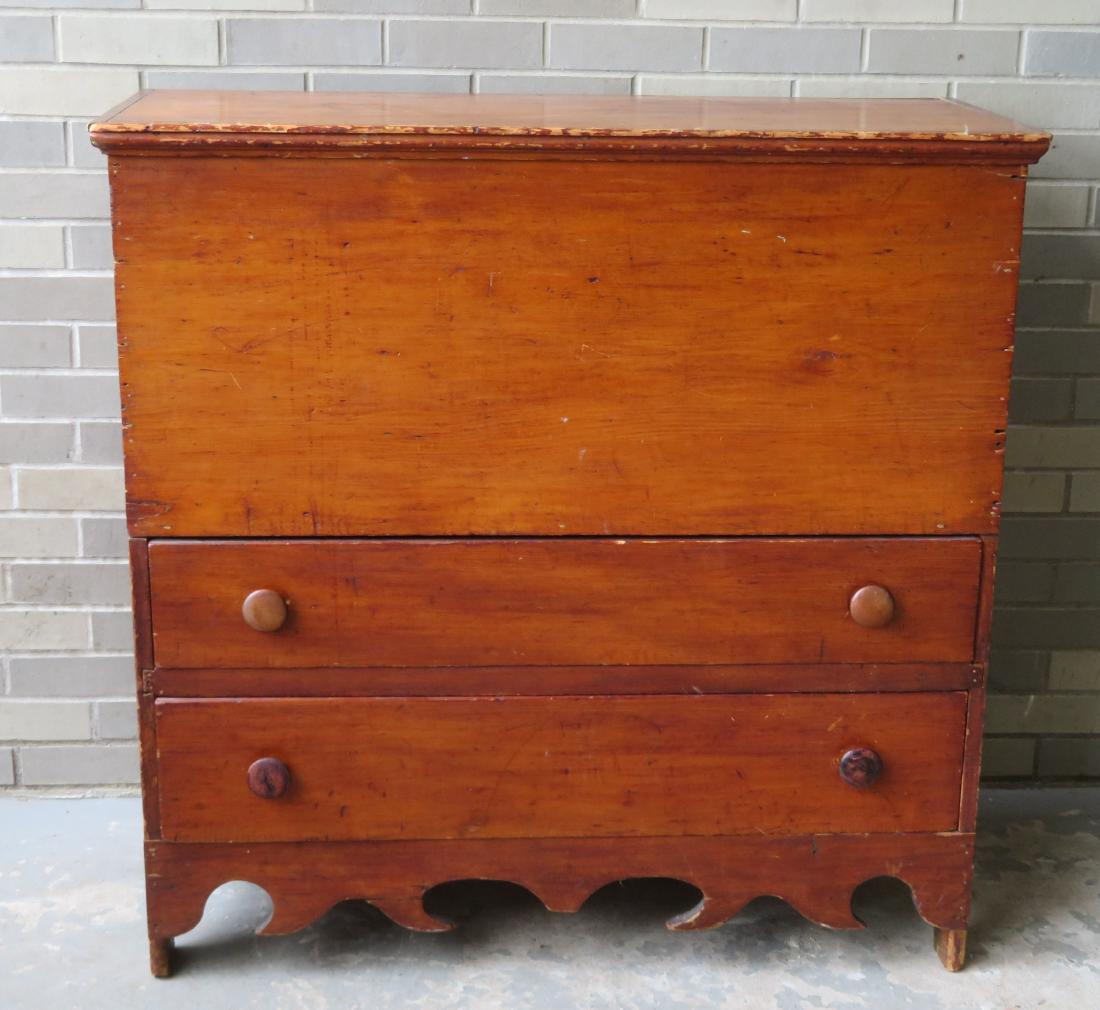 Early pine blanket box with 2 lower drawers over cutout: Early pine blanket box with 2 lower drawers over cutout base, dated March 4, 1837 on interior of lid. Refinished and with minor blemishes, small wood chip repair upper right corner, hinged areas with 