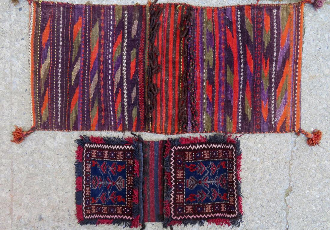 Two hand made tribal saddle bag Kilims: Two hand made tribal saddle bag Kilims - 44"L x 20 1/2"W & 27"L x 14"W- both mid to late 20th century. One with yellow stain/splotches, otherwise very good condition.