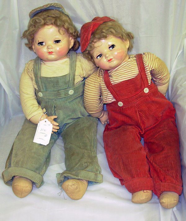 Twin dolls in original costumes - Marked Effanbee.: Twin dolls in original costumes - Marked Effanbee. 24". Some crazing to face - one doll missing pinky finger.