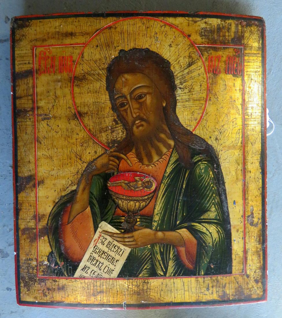Large Russian icon, oil on board, depicting St. John: Large Russian icon, oil on board, depicting St. John the Baptist holding a religious script and pointing to a chalice possessing Jesus Christ's infant body - the interior edge of the chalice is marked