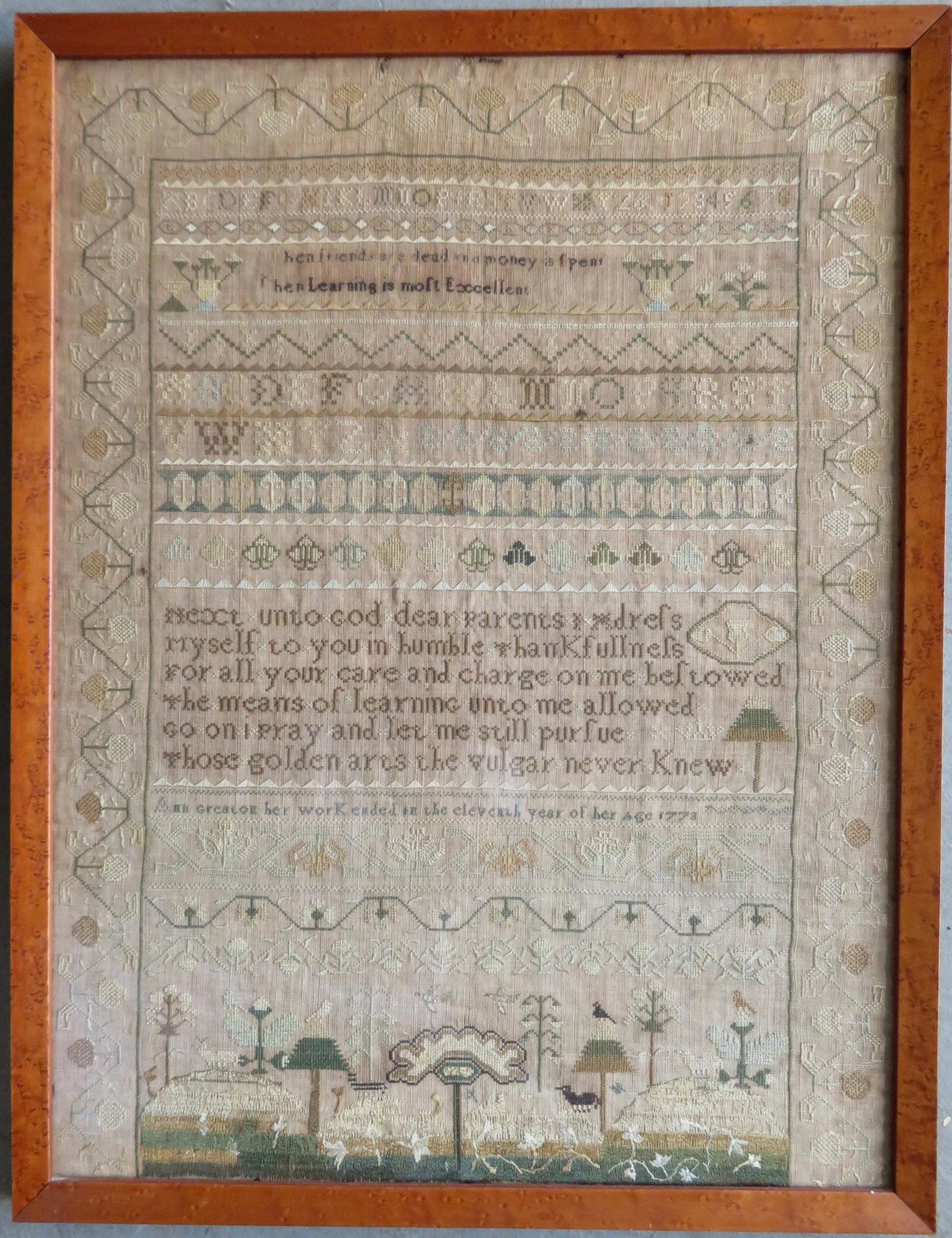 A very fine 18th century sampler with alphabet, mottos,: A very fine 18th century sampler with alphabet, mottos, and pictorial decorations, silk thread on linen, signed "Ann Greaton her work ended in the eleventh year of her age 1773" - Note that an Ann Gre