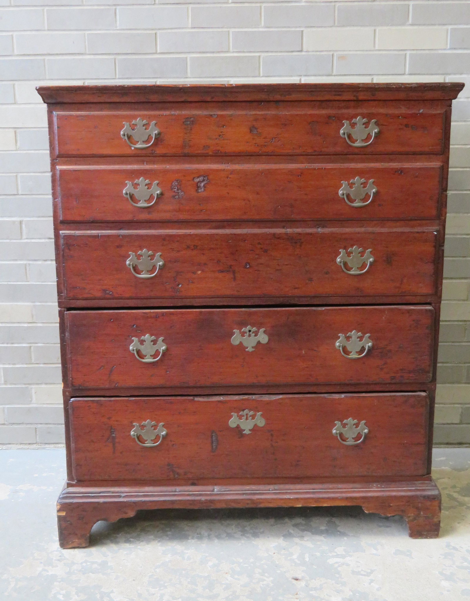 Chippendale pine blanket box on bracket base having 3: Chippendale pine blanket box on bracket base having 3 false drawers over 2 drawers, all with molded edges and pulls appear to be original. Good condition. Late 18th century. 37 1/2"W x 17 1/29"D x 44"