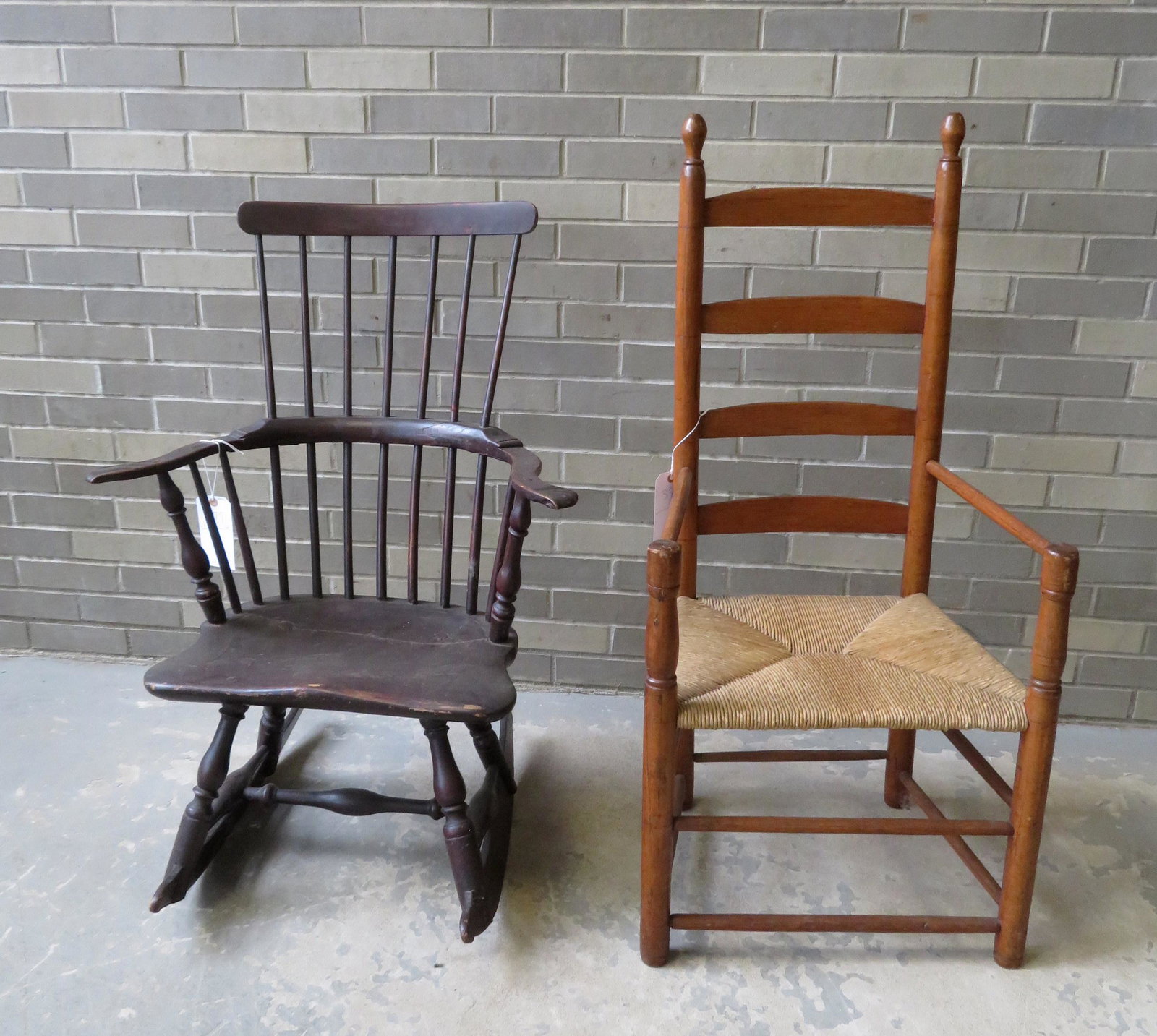 Two country chairs including a Windsor spindle-back: Two country chairs including a Windsor spindle-back rocker with saddle seat and knuckle arms and bulbous leg and stretcher turnings - seat with repaired crack otherwise good stable condition; and a go