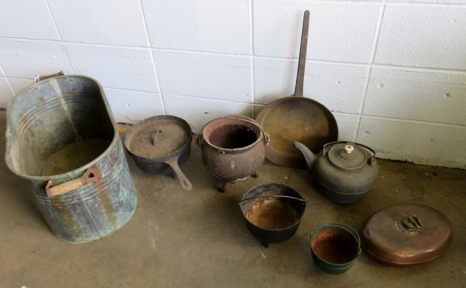 Grouping of country cast iron objects including a cast: Grouping of country cast iron objects including a cast iron goose neck tea kettle signed Je. Rathbone Albany NY, 3 small iron kettles, 2 frying pans one cast iron with lid, a copper bed warmer (with d