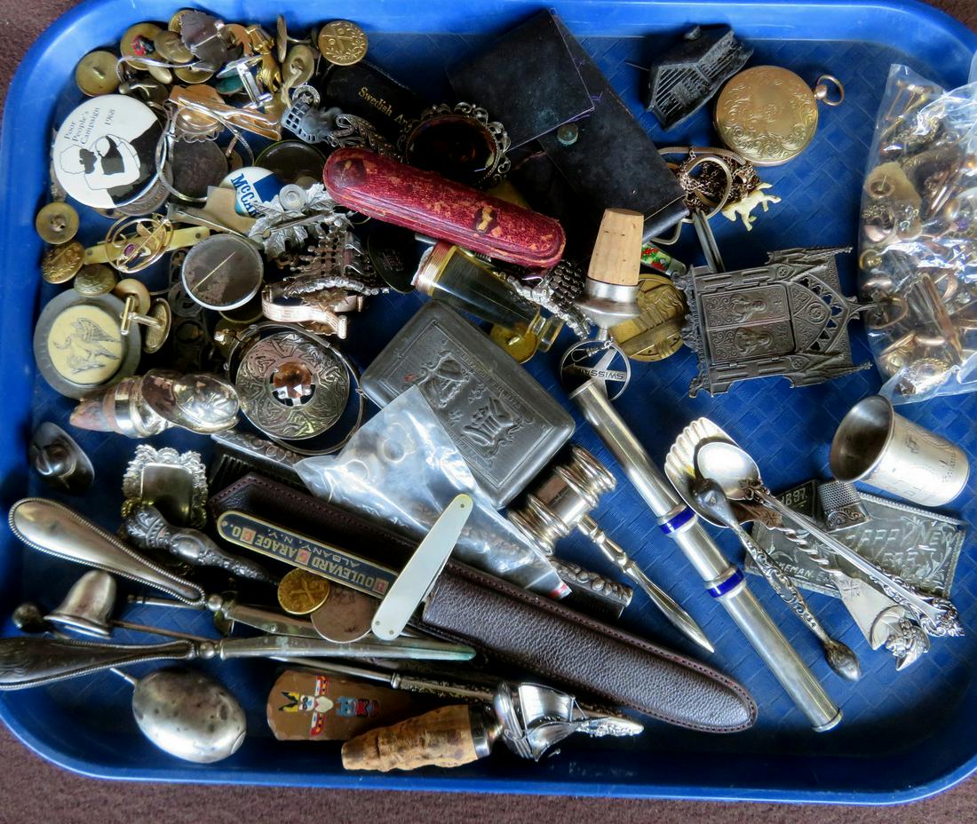 Large grouping of decorative objects including several: Large grouping of decorative objects including several sterling flatware pieces, a marked .900 silver pen holder, costume jewelry, silver figural stoppers, various metal buttons, several advertising a