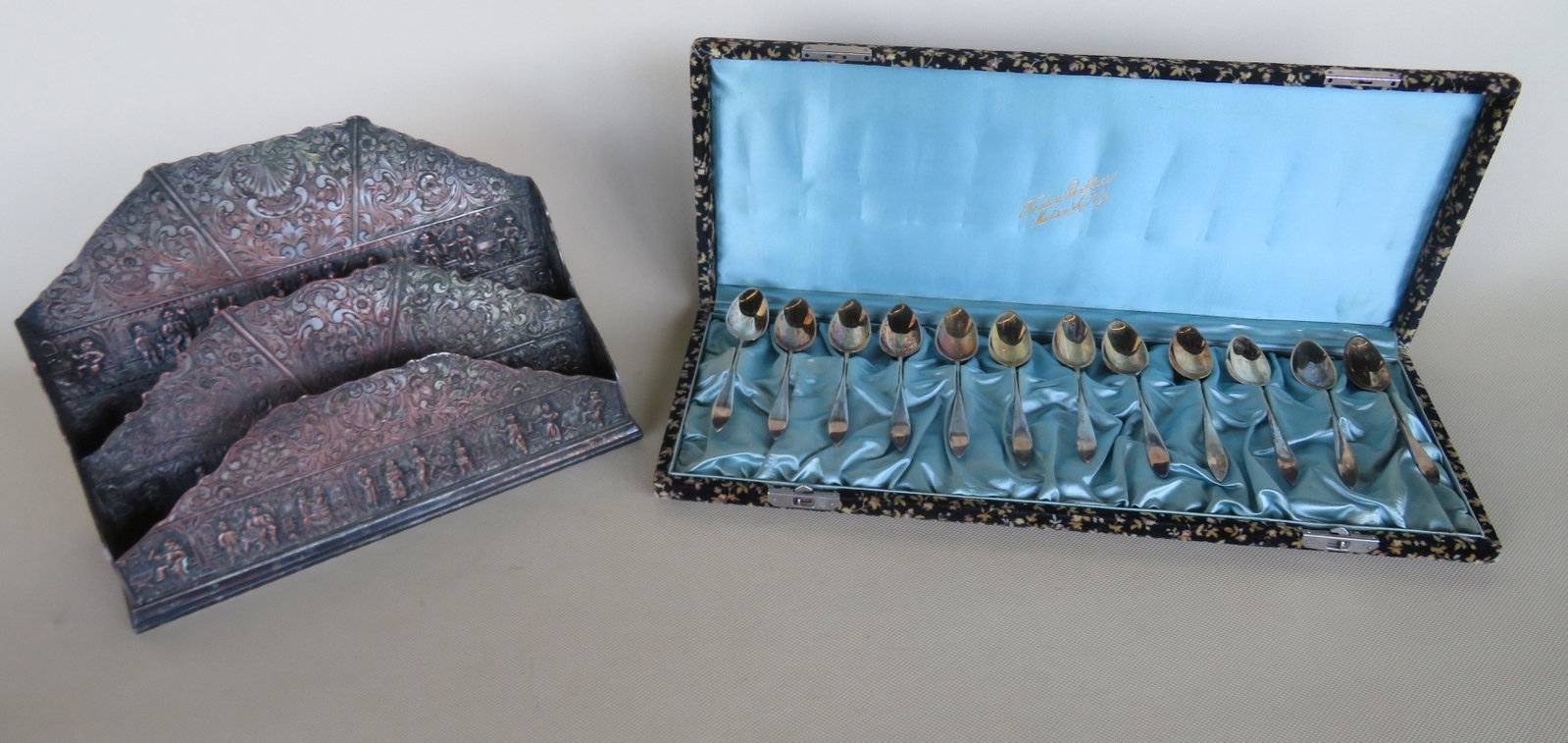 A boxed set of sterling silver demitasse spoons -: A boxed set of sterling silver demitasse spoons - hallmarks on each spoon and case marked Theodore B. Starr - Madison Sq - NY, very good condition; and a European silver envelope holder profusely deco