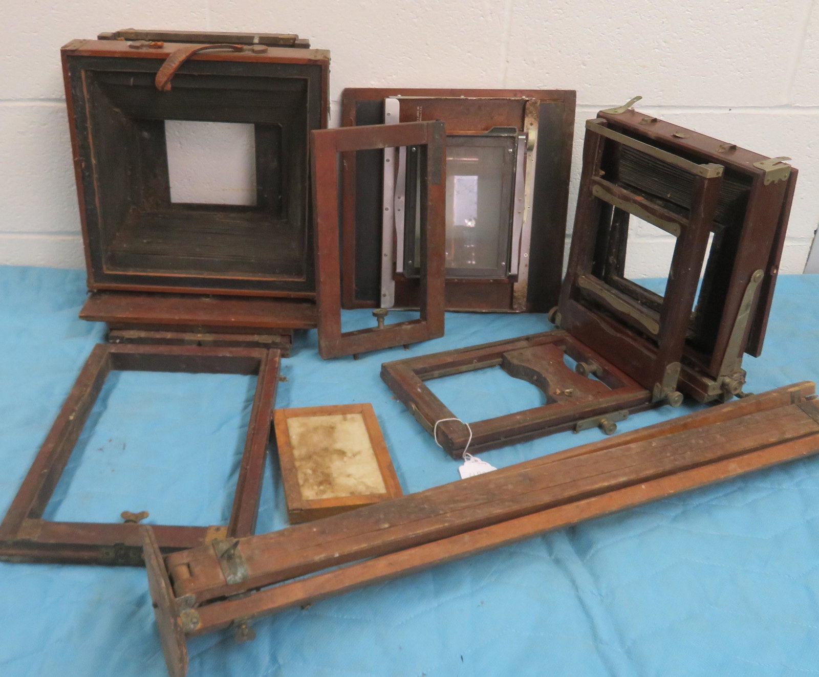 Two wooden bellows cameras in need of restoration.: Two wooden view cameras in need of restoration. Sold with a period camera tripod. One camera signed Burke & James - Chicago and with plaque marked "Eastman View No. 2 / Improved Model of Century View 