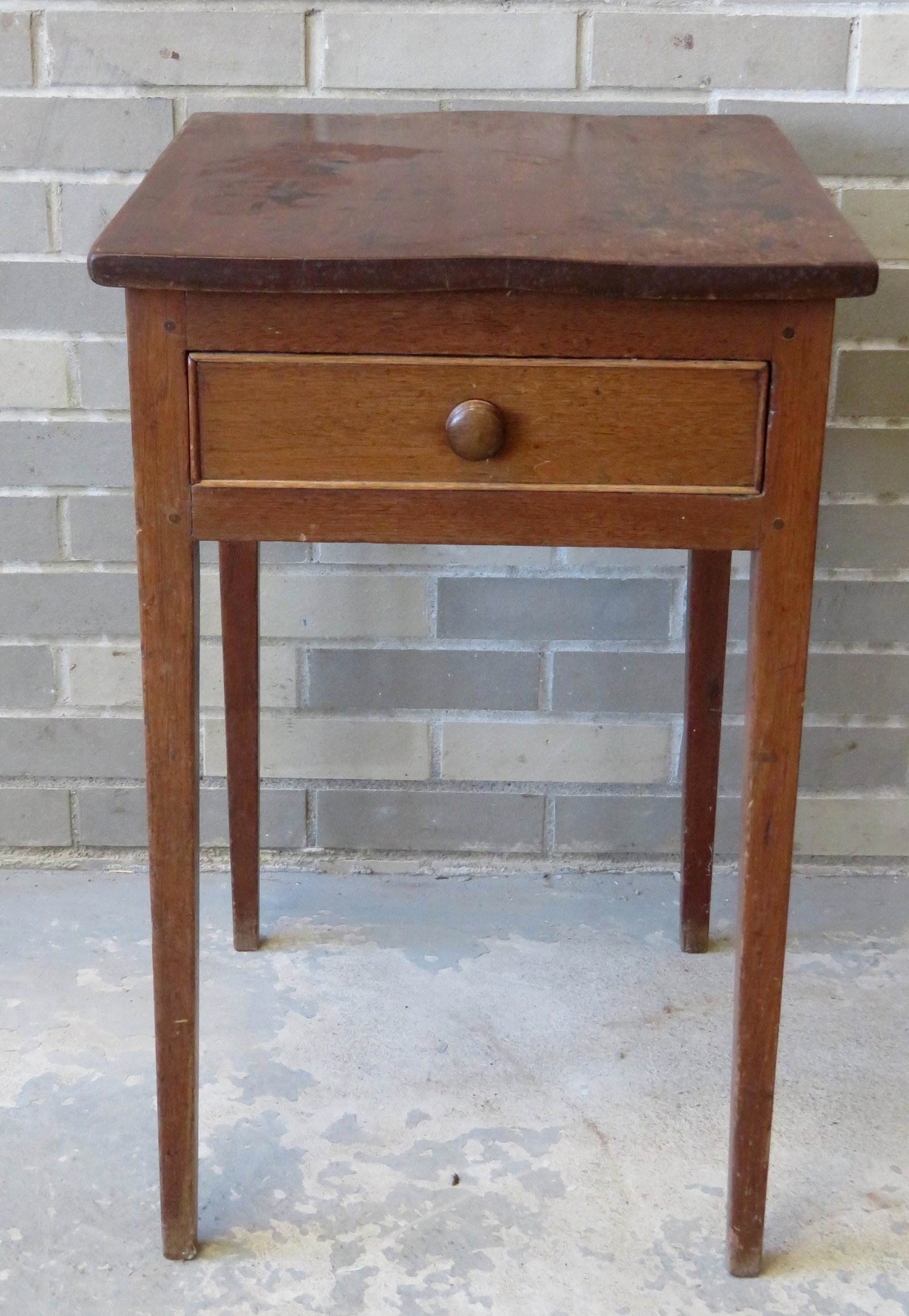 Hepplewhite butternut 1 drawer stand, traces of: Hepplewhite butternut 1 drawer stand, traces of original red stain, circa 1810. Small repair to back leg, else good condition with typical use wear.