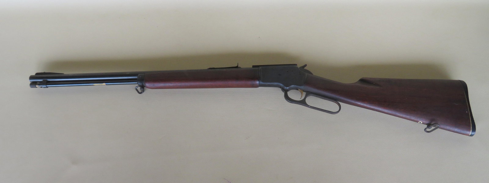 Marlin Golden 39A Mountie .22 caliber lever action: Marlin Golden 39A Mountie .22 caliber lever action rifle in S,L ,and Long Rifle. Walnut stock, gold wash trigger, tube fed, iron sight with a ramp mount for a scope, serial number 1716; Barrel 20 1/2"