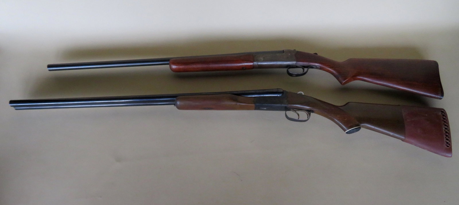 Two shotguns: 1) Brazilian 20 ga., double barrel: Two shotguns: 1) Brazilian 20 ga., double barrel shotgun, imported by the F.I.E. Corp., Miami Florida - barrels dirty and need cleaning, slight surface rust to bluing, overall good working condition -