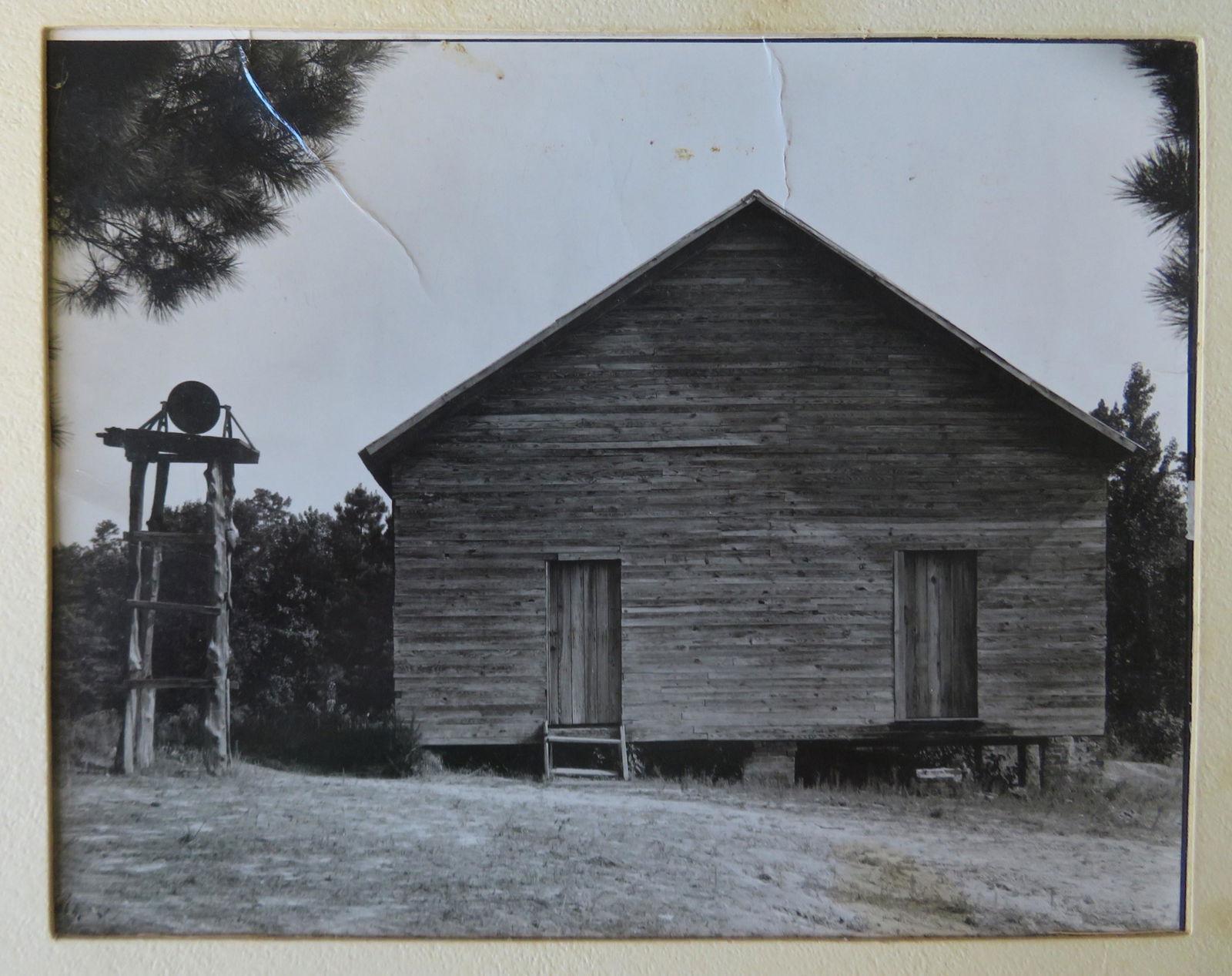 Walker Evans (NY, CT, Missouri) 1903-1975. Photograph: Walker Evans (NY, CT, Missouri) 1903-1975. Photograph of an old southern schoolhouse with Walker Evans stamp on reverse and signed in pencil "#759 School with separate bell, Alabama 1936". Multiple cr