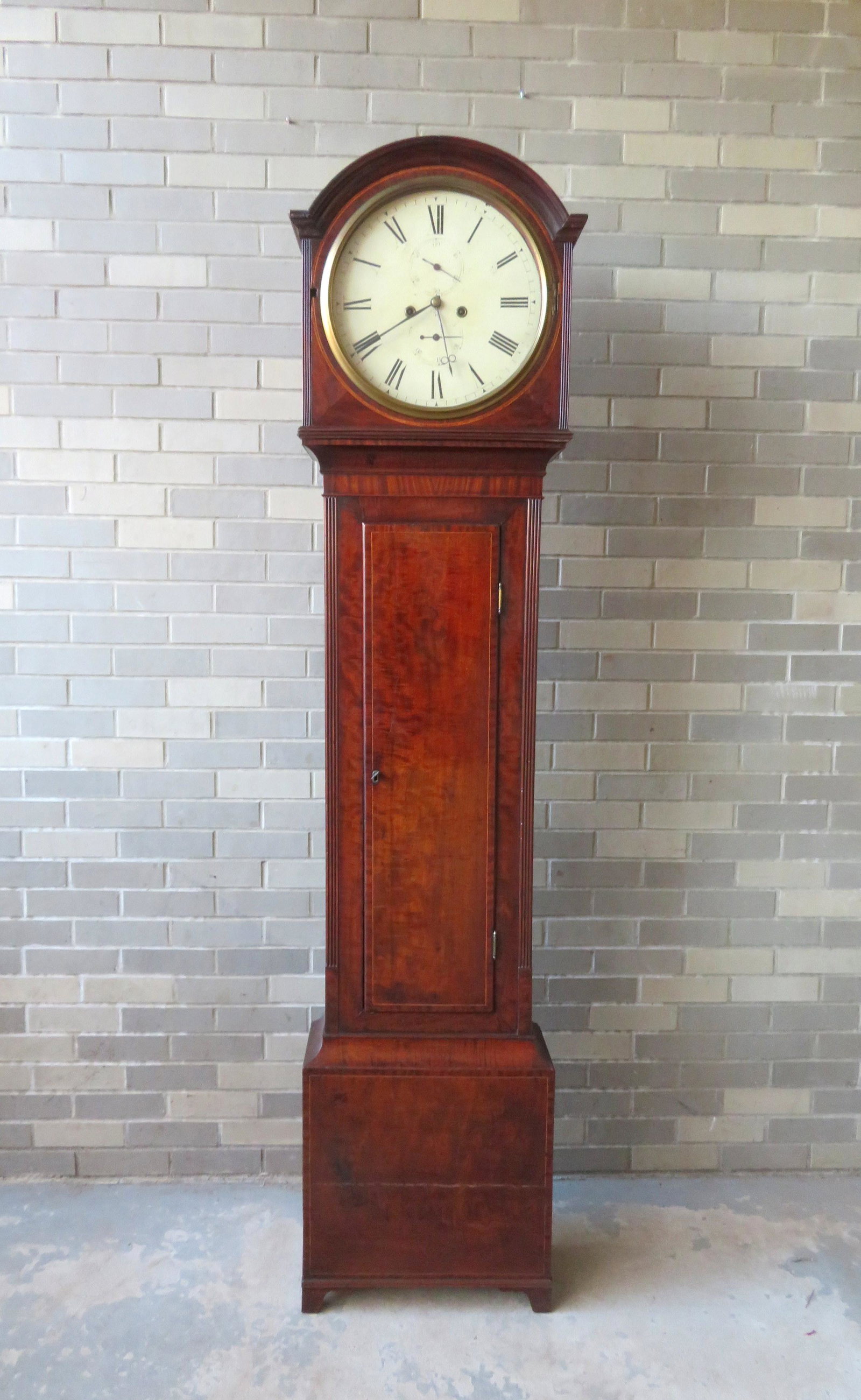 Hepplewhite mahogany dome-top tall case clock with: Hepplewhite mahogany dome-top tall case clock with brass works, early 19th century.To be updated xxx.