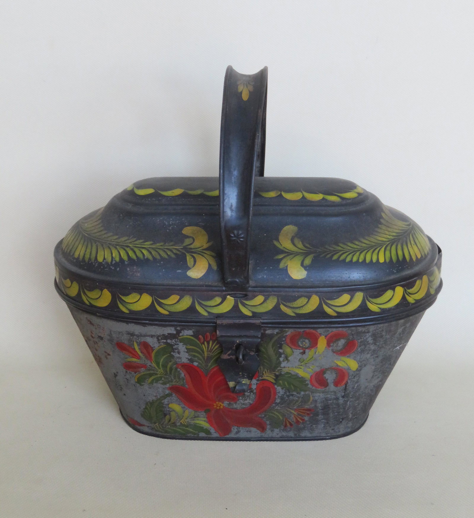 Toleware lunch pail with fixed loop handle, 19th: Toleware lunch pail with fixed loop handle, 19th century - the top appears to be either be touched up or in older second paint, and signed Joann Scholk, the sides of the pail painted with a floral des