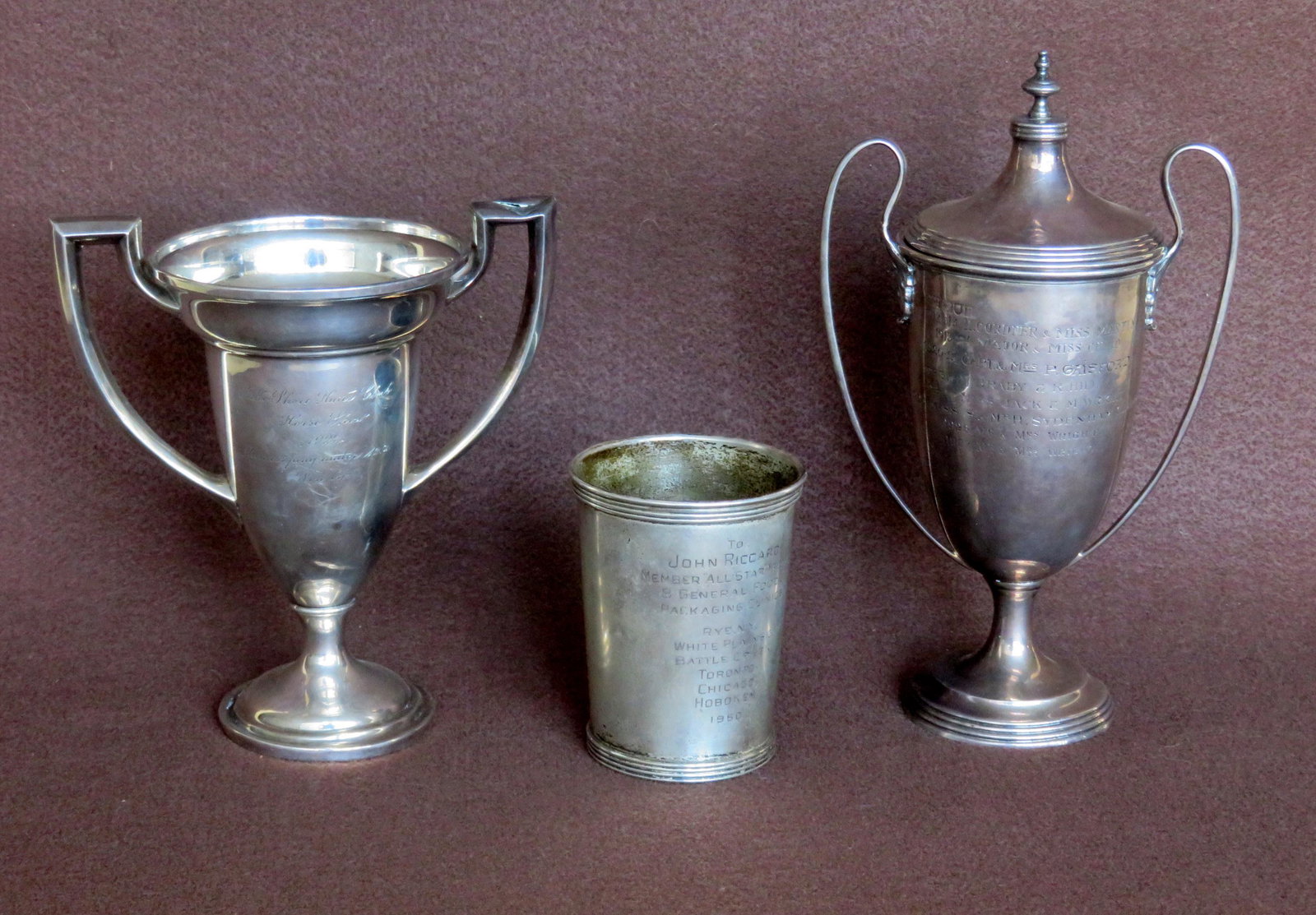Three sterling silver trophies including a cup for: Three sterling silver trophies including a cup for "Packaging Clinics" from General Foods 1960; a loving cup with lid engraved "Booth Challenge Cup / Diablerets Doubles Lugeings / Championship" - prev
