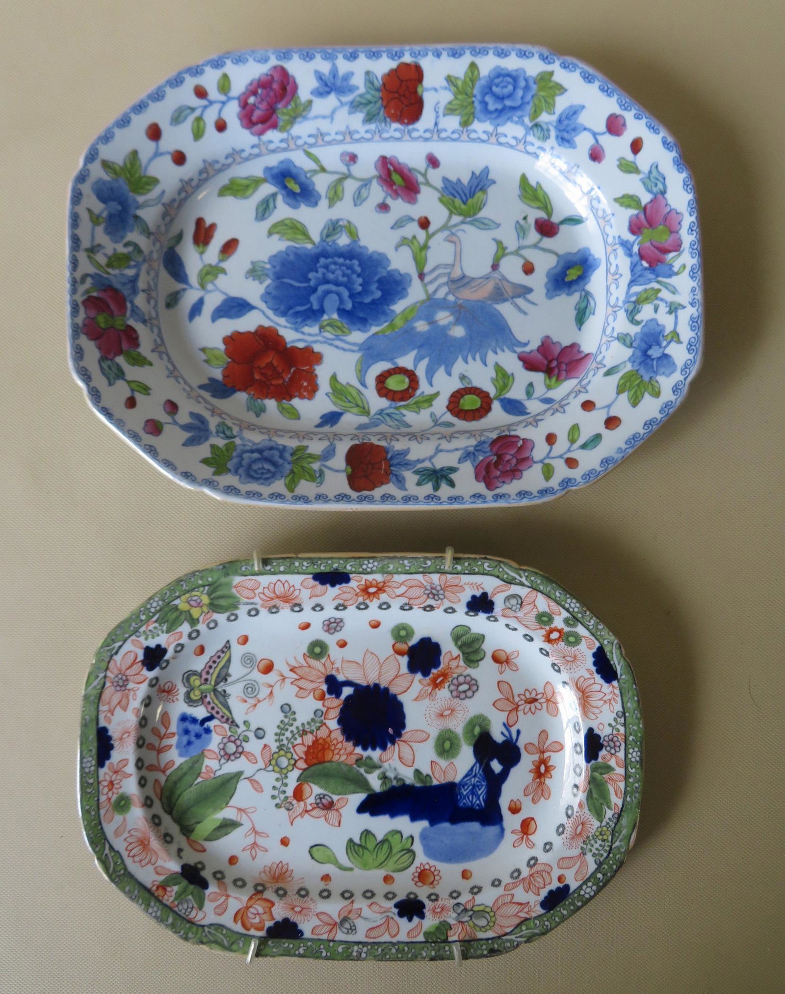 Two colorful 19th century small octagonal ironstone: Two colorful 19th century small octagonal ironstone platters: 1) Signed "Mason's / Patent Ironstone China" decorated with flowers, vines, and a butterfly - 10 1/4" x 7 1/2"; 2) Signed "Ironstone China