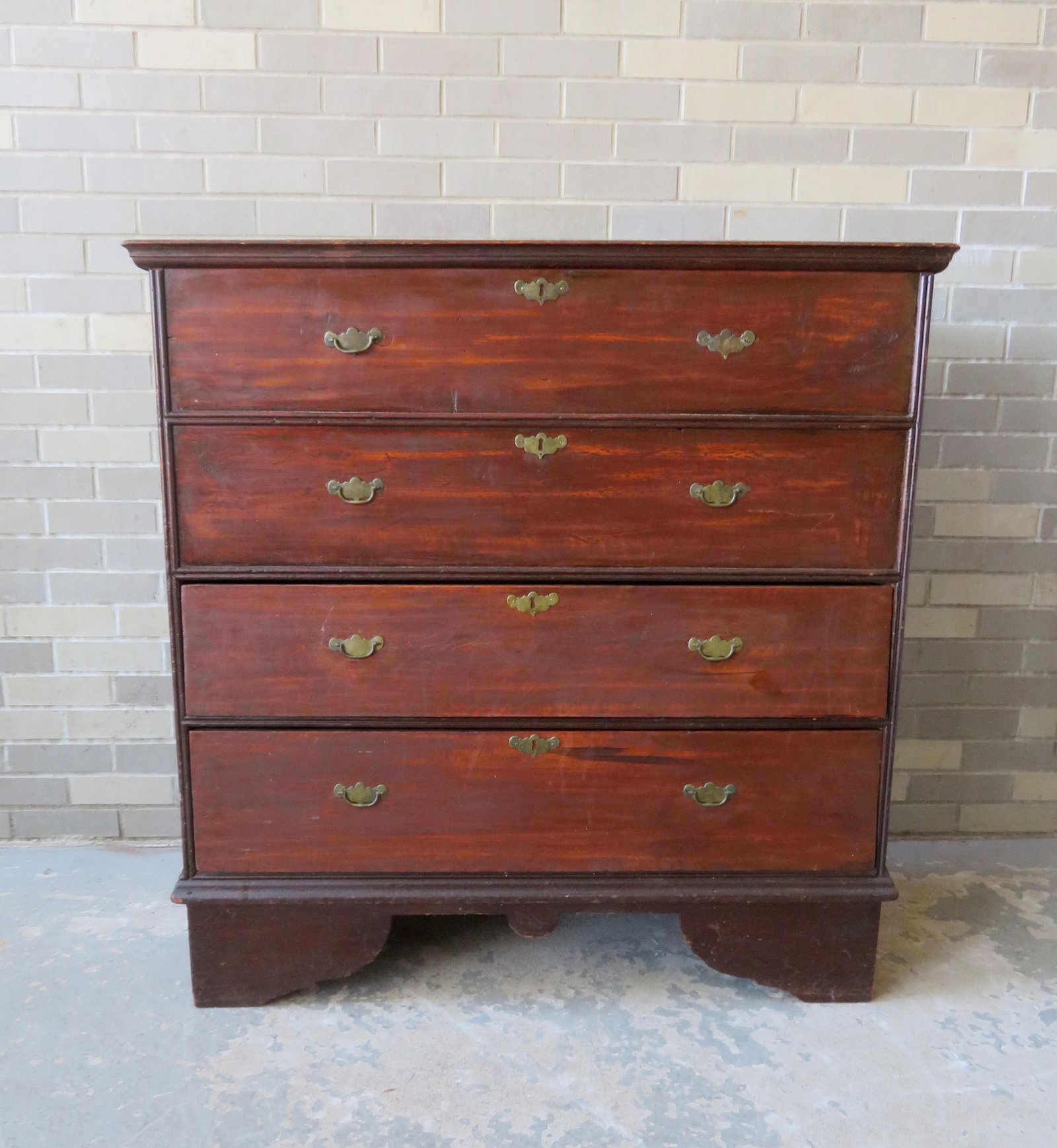 Queen Ann period New England blanket chest having 2: Queen Ann period New England blanket chest having 2 false drawers over 2 drawer. Original cotter pin hinges. The front with its original red stain (scrubbed) and the frame in its original untouched re