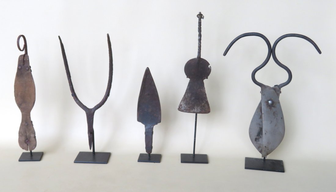 Grouping of 5 implements mounted on museum iron mounts: Grouping of 5 implements mounted on museum iron mounts including a pair of hand forged iron scissors, an ice skate, a hand forged iron spatula, a hand forged iron tool with spear shaped head, and a do