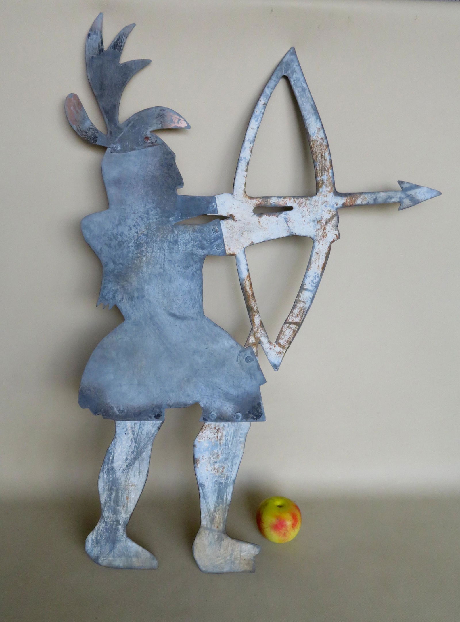 Sheet iron silhouette trade sign or weathervane in the: Sheet iron silhouette trade sign or weathervane in the form of a Native American shooting bow and arrow, probably early 20th century. Constructed in 5 sections that are riveted together. Very good con