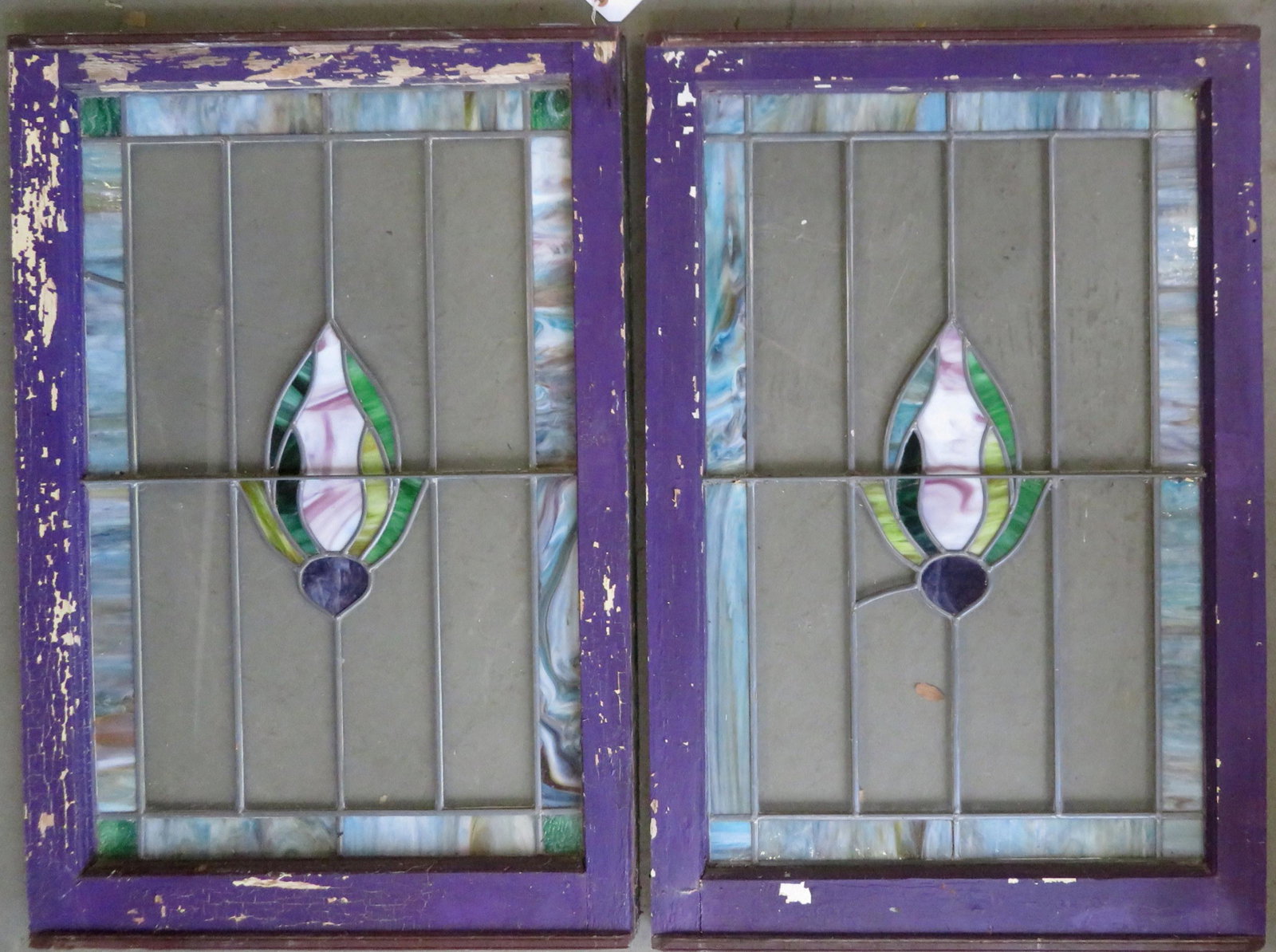 Two leaded and stained glass windows, Art Deco design: Two leaded and stained glass windows, Art Deco design circa 1920. Both very good condition. Each window 24" x 36" x 1 1/2" (thick). Together with a slightly damaged section of matching stained glass (
