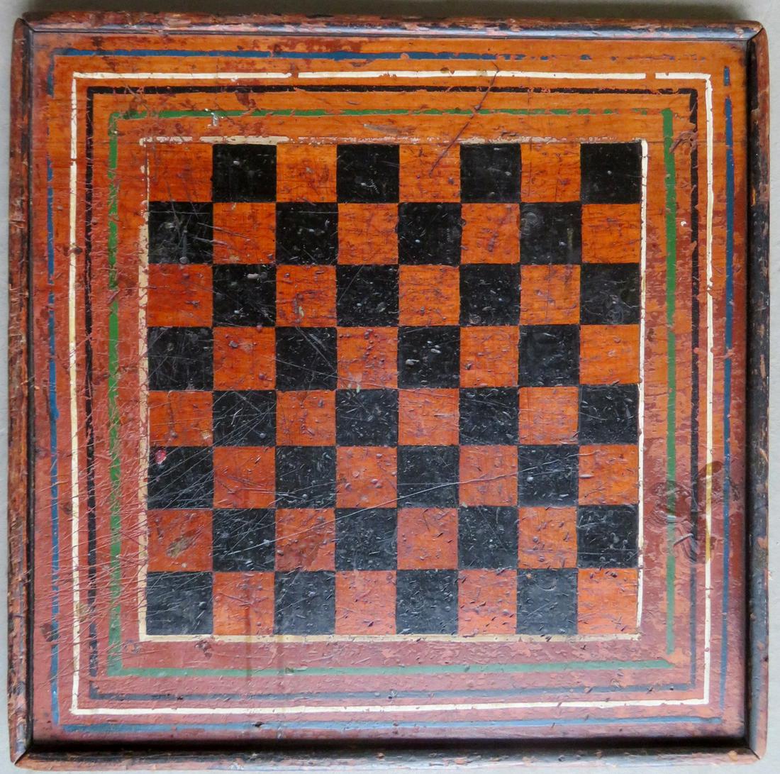 Early game board in black and mustard paint surrounded: Early game board in black and mustard paint surrounded by 5 colorful concentric squares, all in original paint, 19th century. Approximately 18 1/4" x 18 1/4". Surface abrasions, many scratches, some s