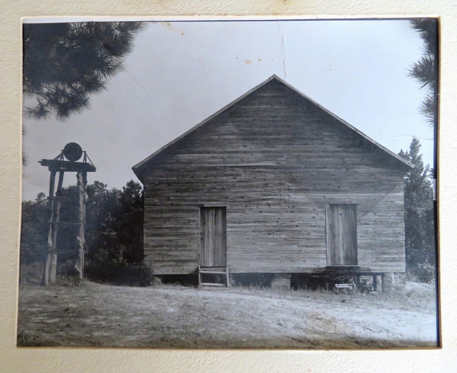 Walker Evans (NY, CT, Missouri) 1903-1975. Photograph: Walker Evans (NY, CT, Missouri) 1903-1975. Photograph of an old southern schoolhouse with Walker Evans stamp on reverse and signed in pencil "#759 School with separate bell, Alabama 1936". Some crease