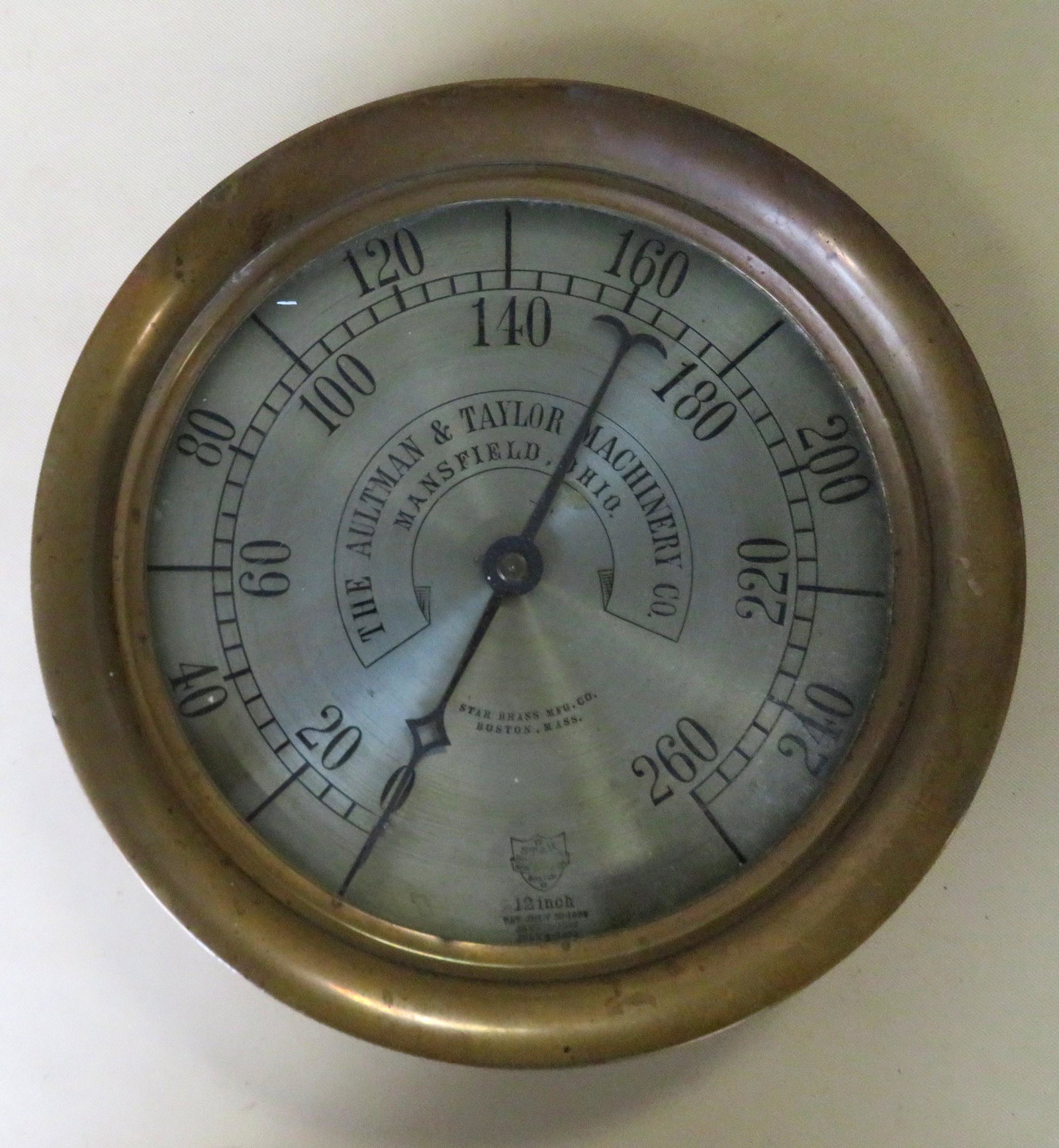 Vintage brass cased steam engine gauge signed "The: Vintage brass cased steam engine gauge signed "The Aultman & Taylor Machinery Co. / Mansfield Ohio./ Star Brass Mfg. Co. Boston, Mass." - last patent date July 1893. Very good condition - Overall size