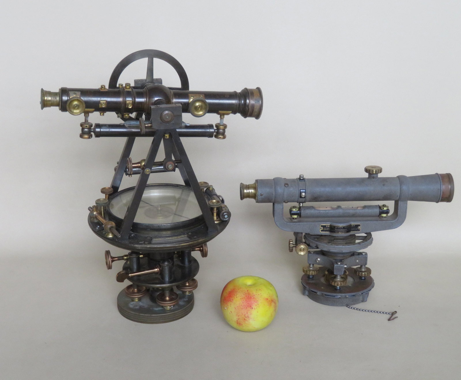 Two Surveyor's transits in original boxes including:: Two Surveyor's transits in original boxes including: The first with an iron frame with brass mountings signed David White Company No. 73782, with original lens cover, very good condition - 12"L x 8"H 