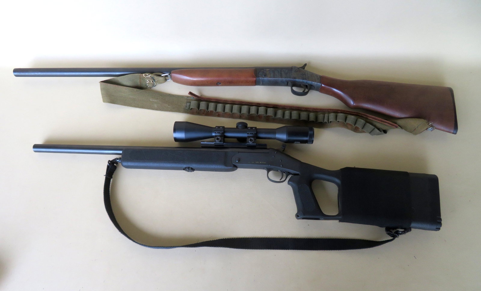 Two firearms including: A New England Firearms Handi: Two firearms including: A New England Firearms Handi SB2, 223 Rem., with mounted scope, very good condition; together with a Harrington & Richardson Model 088 12 gauge single shot shotgun, some use we