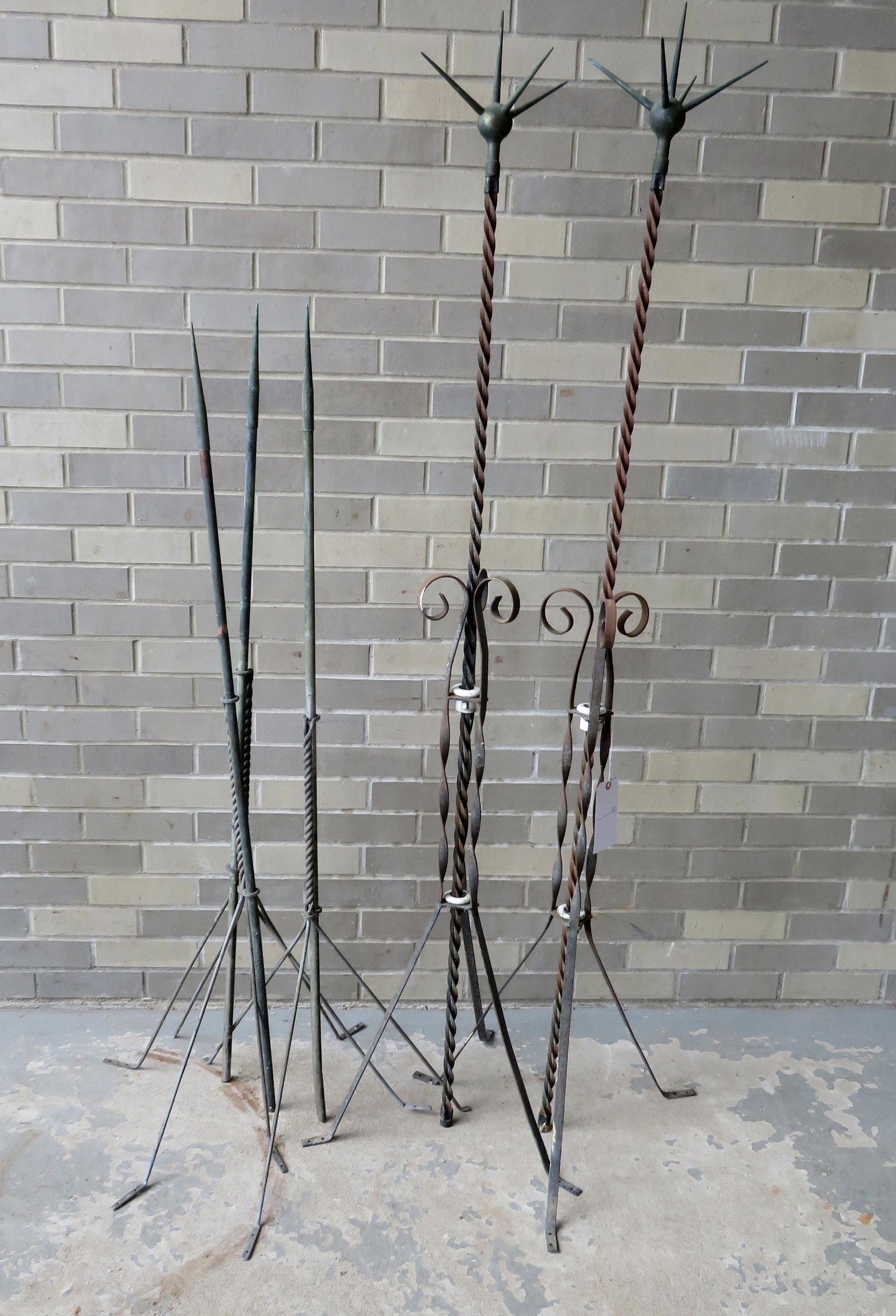 Five lightning rods including 2 with spiked tops: Five lightning rods including 2 with spiked tops patent 1912, all missing balls otherwise very good condition. The spiked rods 69"H and the others 53"H.