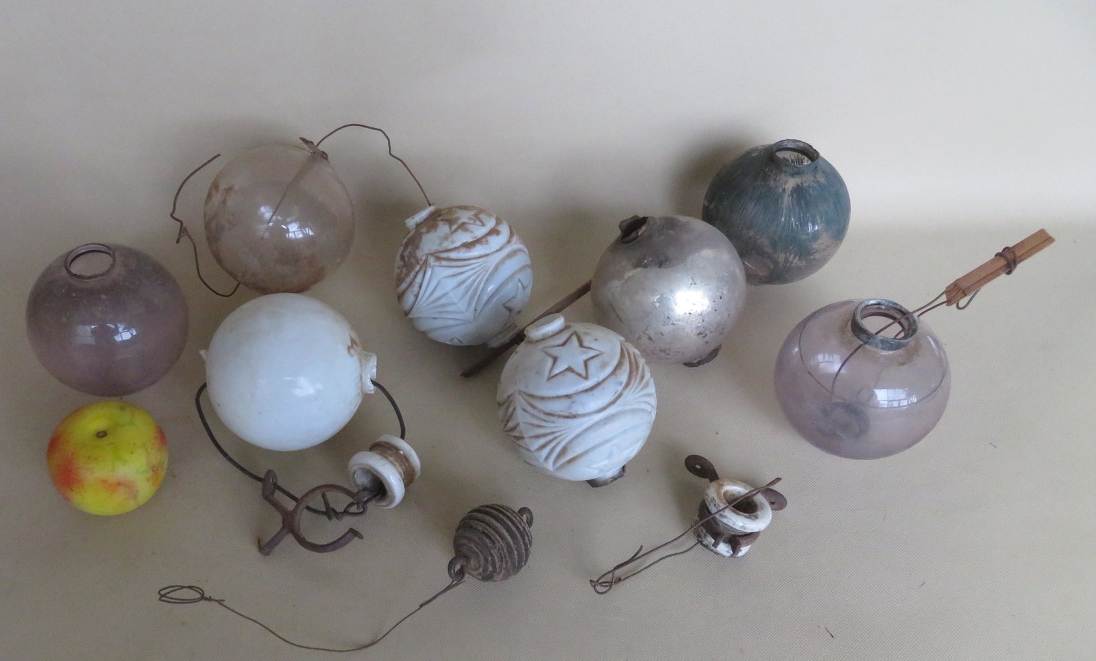Grouping of 8 lightning rod glass balls including 2 in: Grouping of 8 lightning rod glass balls including 2 in opaque white decorated with stars and crescent moon and 2 with a light violet color. Most with minor collar use wear (chips/losses), but the ball