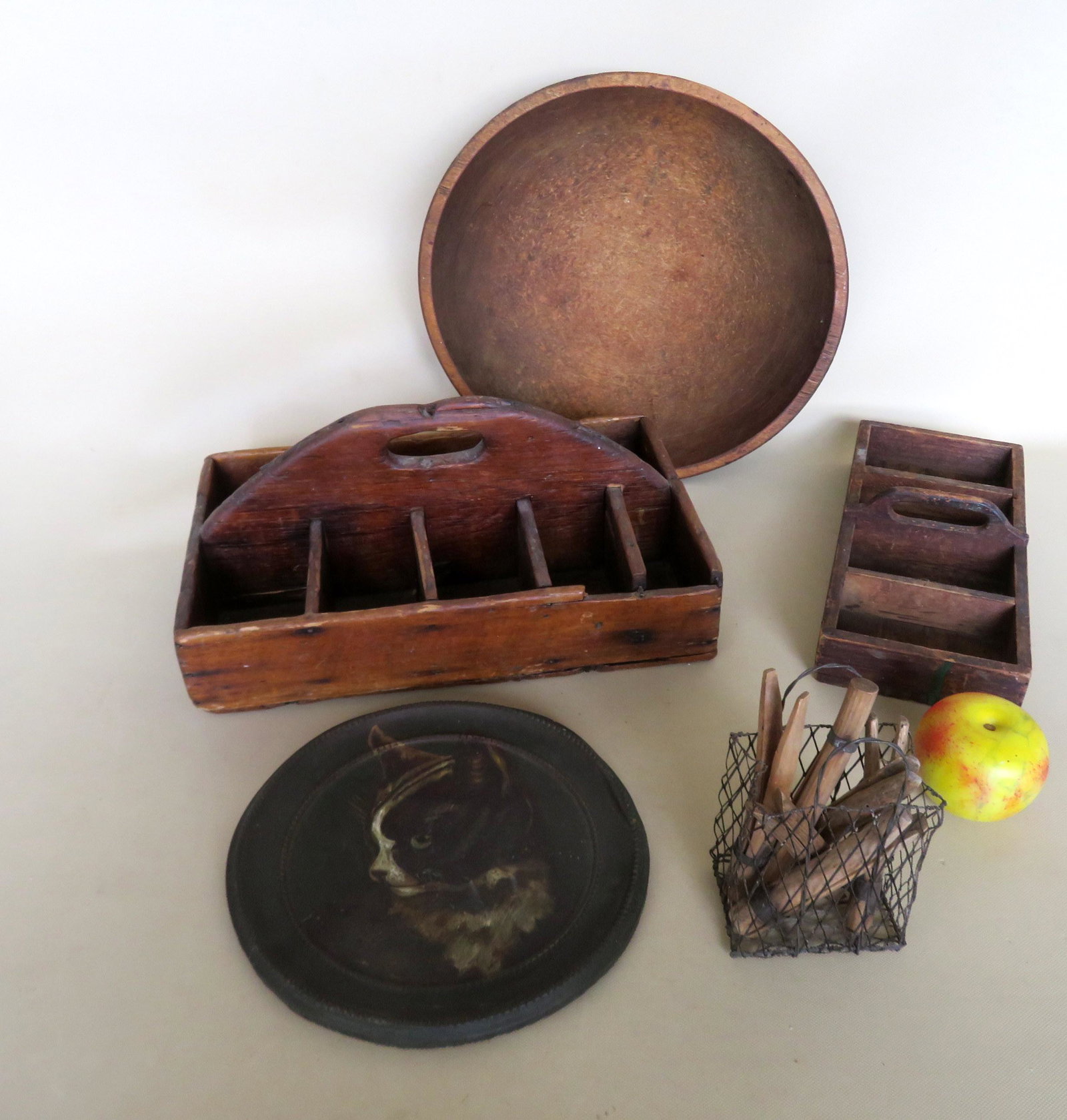 Grouping of 11 country collectibles including: Two: Grouping of 11 country collectibles including: Two primitive wooden tool and nail carriers, probably for farrier - the largest 15"W x 9 1/2"W x 6 3/4"H; a wire basket with 6 wooden hand made clothes p