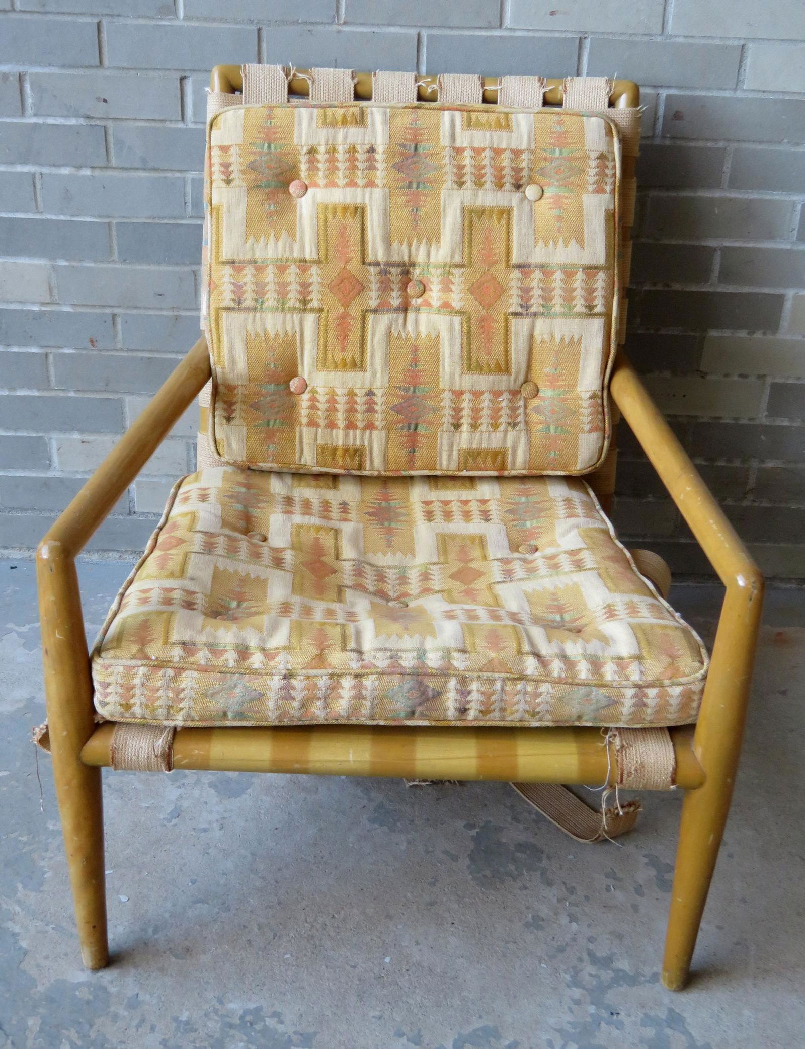 Robsjohn Gibbings for Widdicomb, arm chair with maple: Robsjohn Gibbings for Widdicomb, arm chair with maple frame, upholstered seat and back in Native American style which appears to be original. The supporting straps are broken and need replacement. 26"