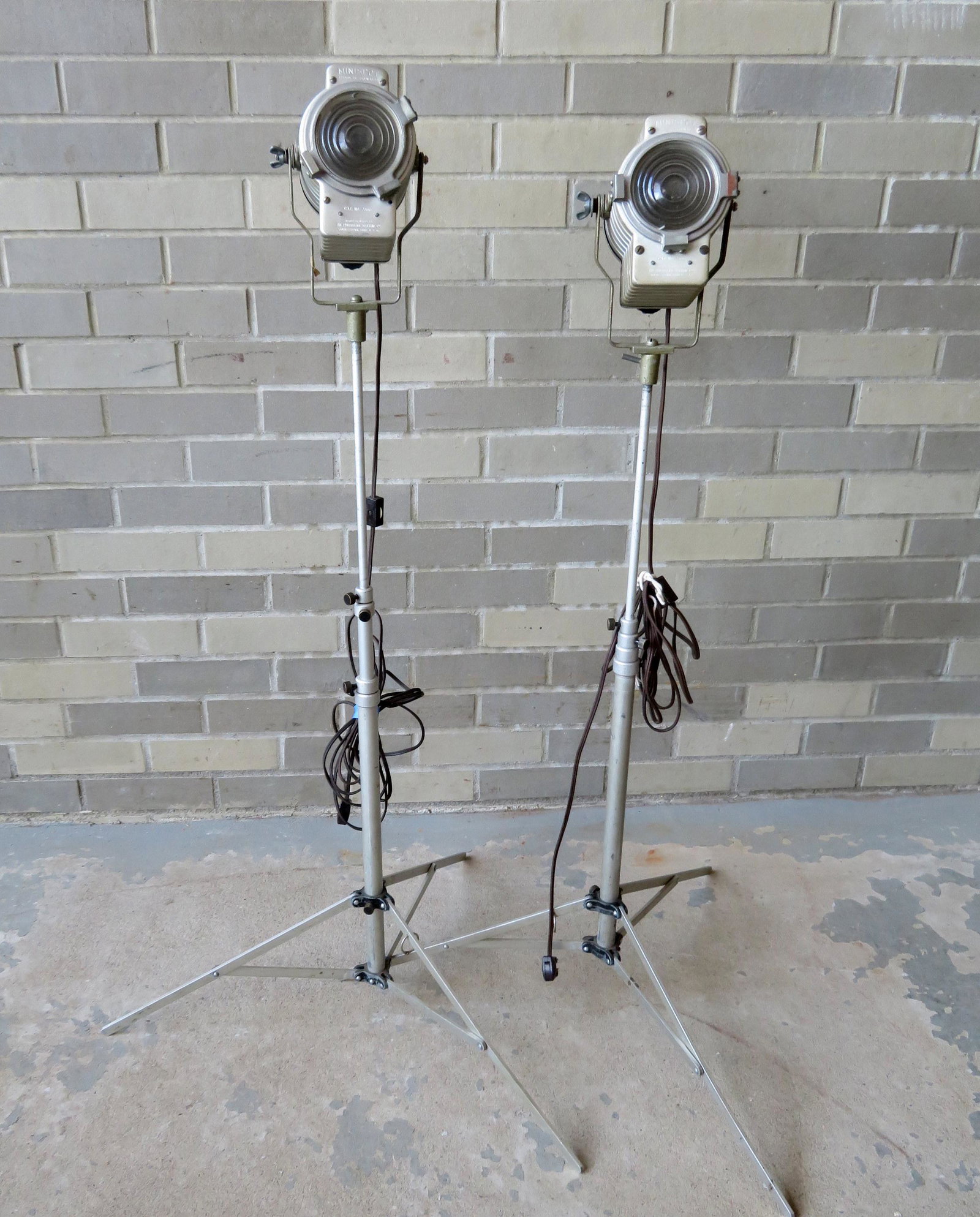 Pair of adjustable Minispot adjustable stage lights: Pair of adjustable Minispot adjustable stage lights from Photogenic Machine Co. - both good condition. Set screw stripped on lamp, else good condition. Maximum height 63" to lowest position 27"H. They